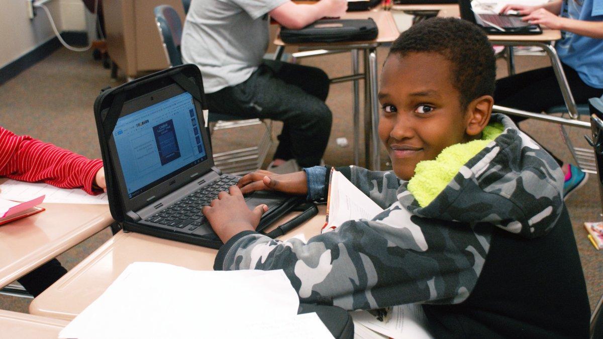 Student works on a laptop